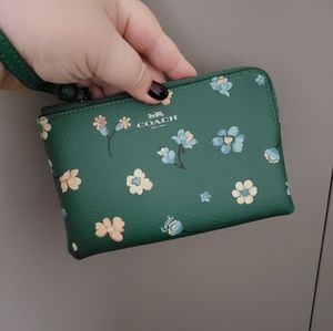 Coach wristlet with floral print